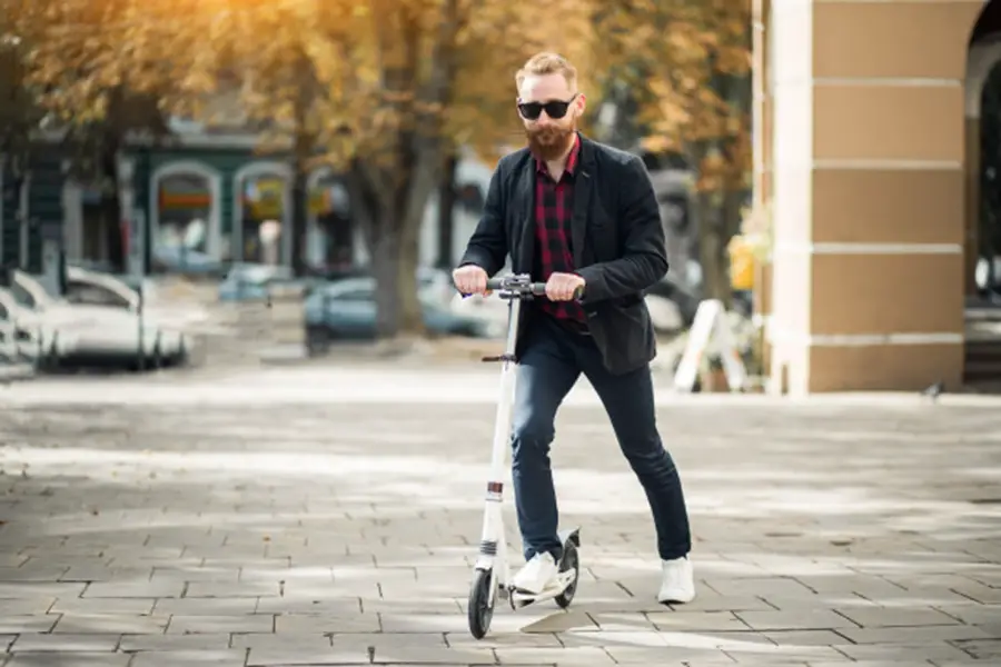 bearded man with razor ecosmart metro electric scooter