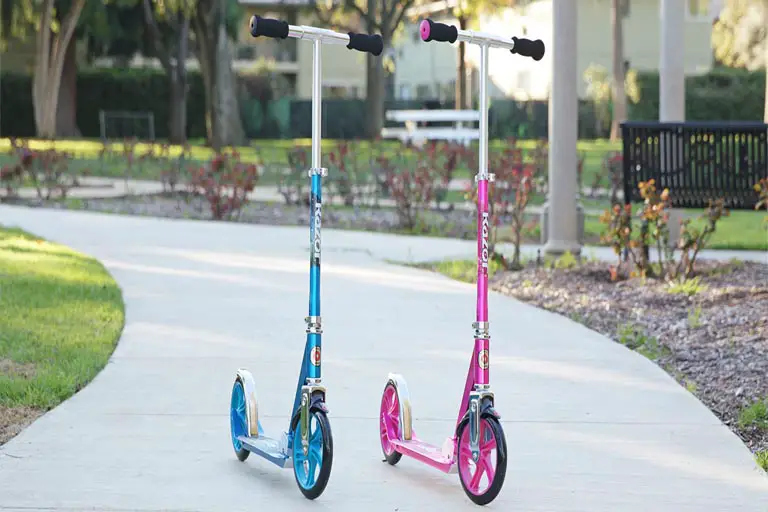 pink and blue colored razor a5 lux scooters standing in the park