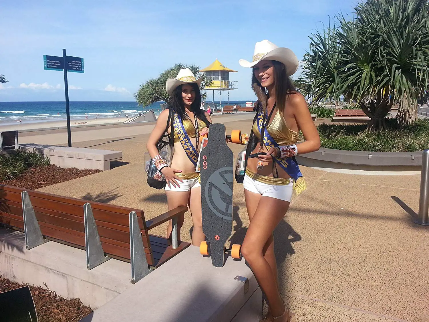 ladies showing their Yuneec E-go Electric Skateboard 